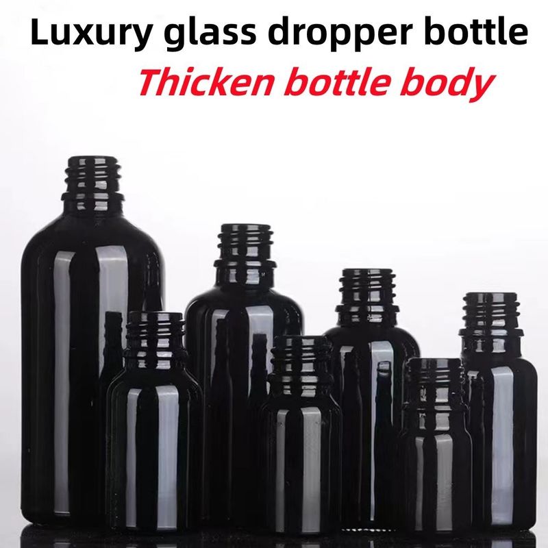 Siyah 10, Ml 15ml 20ml 30ml 50ml boş, yuvarlak siyah parlak cam esanslı yağ damlatıcı şişesi Plastik Altın halka ile